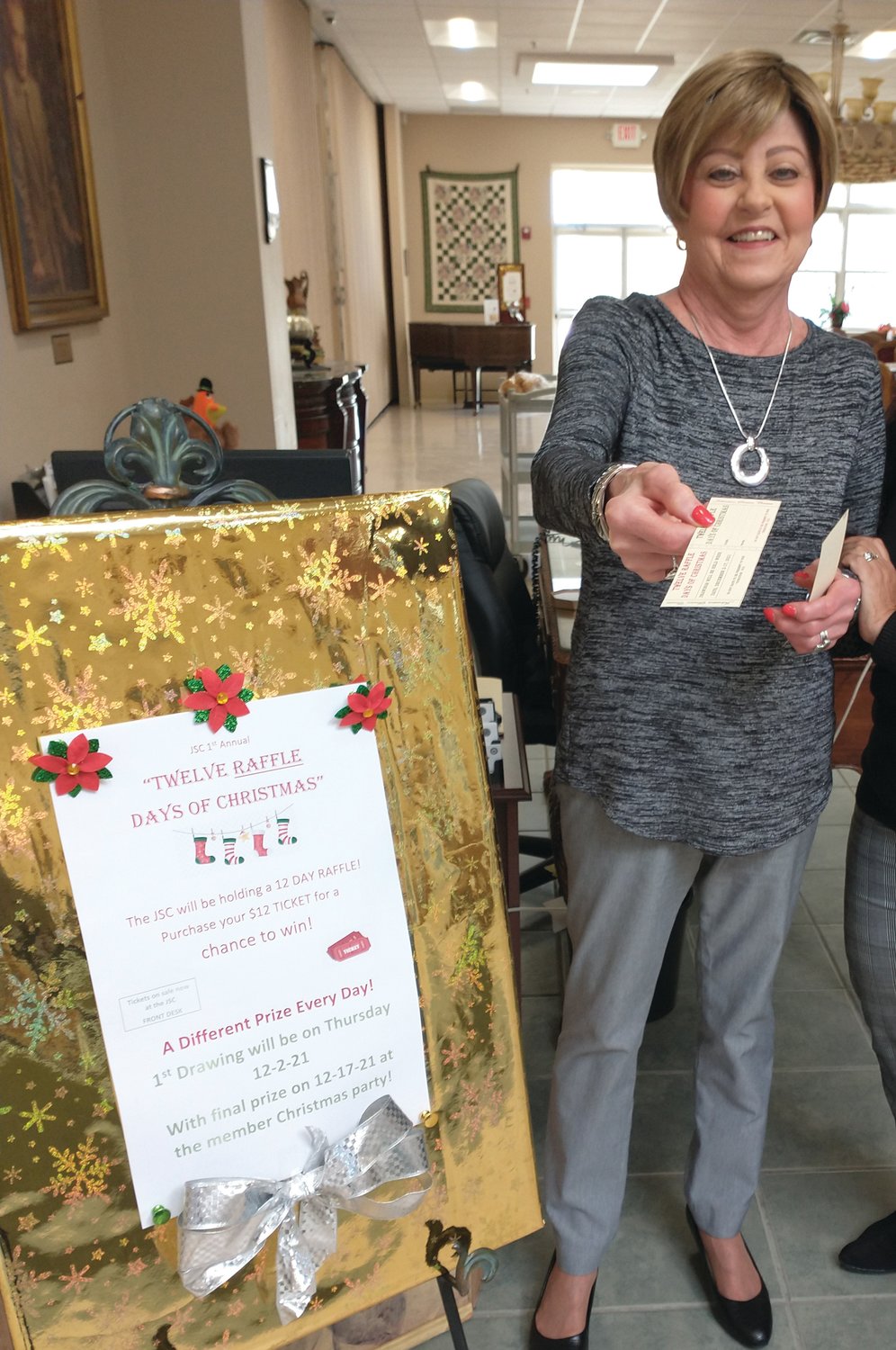 PARTRIDGE IN A PEAR TREE: Gail Krikorian holds a raffle ticket in anticipation the first day of “Twelve Raffle Days of Christmas,”  when a drawing will be held each weekday for 12 days from Thursday, Dec. 2 until Friday Dec. 17.
